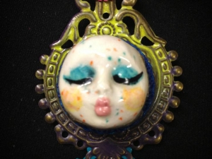 Ceramic kissing face necklace